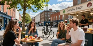 Where Can I Get Top Quality Edibles In Dublin? Friends enjoying colorful THC-infused gummies in a vibrant Dublin café setting.